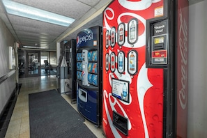 Vending machines with various beverage options in a hallway. - Red Roof Inn Charlotte - University (Charlotte)