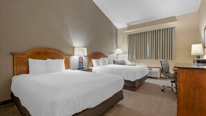 A hotel room with two beds, a desk, and a chair. - Best Western University Inn (Ithaca)