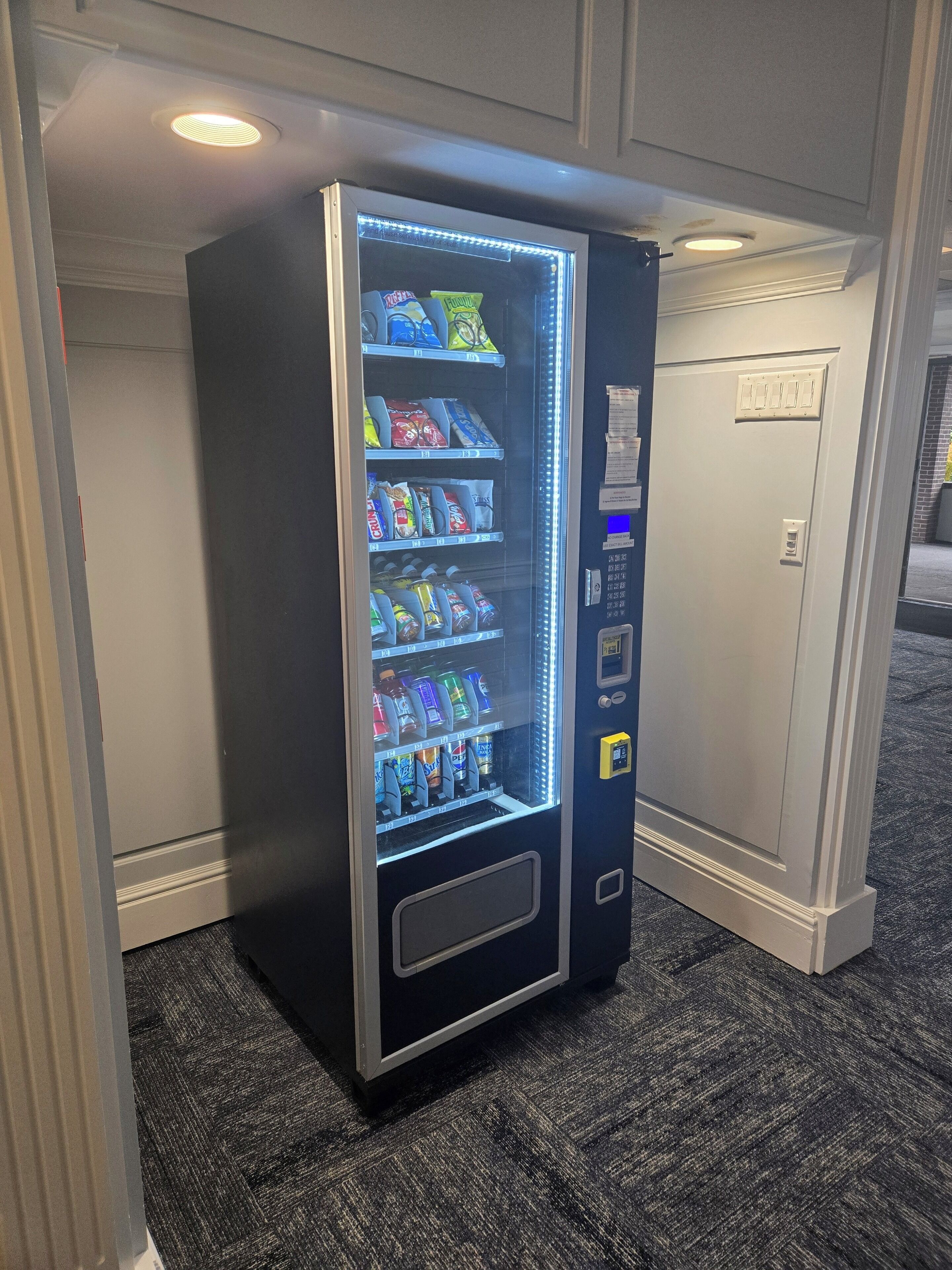A vending machine with various snacks and drinks.
