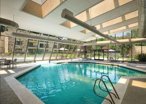 Indoor pool, seasonal outdoor pool, pool umbrellas, pool loungers