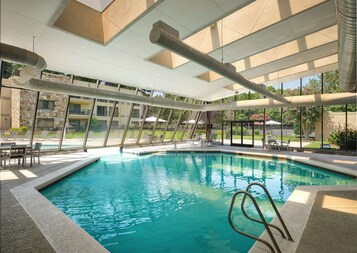 Indoor pool, seasonal outdoor pool, pool umbrellas, pool loungers