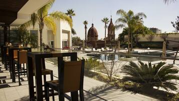 Outdoor pool, open 8:00 AM to 8:00 PM, pool umbrellas, sun loungers
