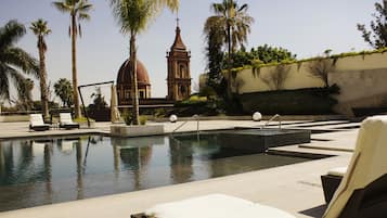 Outdoor pool, open 8:00 AM to 8:00 PM, pool umbrellas, sun loungers