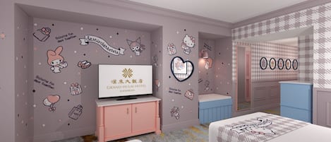 A hotel room with a television, pink cabinet, and a bed with a patterned bedspread.