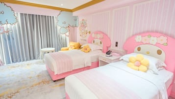 A pink-themed bedroom with two beds, a small round table, and a large window with curtains.