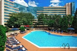 Seasonal outdoor pool, open 9:00 AM to 11:00 PM, pool umbrellas