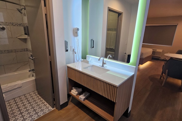 1 King Bed with Makeup Station Non-Smoking | Bathroom | Hair dryer, towels