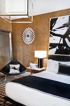 Hotel amenities such as safe, desk and work area at Ameritania Hotel at Times Square