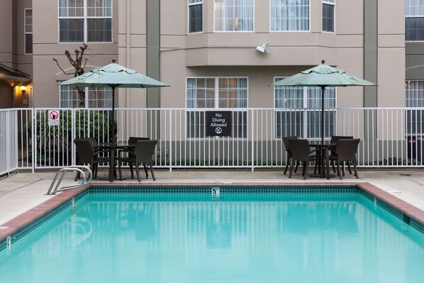 Relax by the pool surrounded by comfortable seating and a tranquil atmosphere.