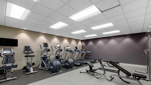 A gym with various exercise equipment, including treadmills, elliptical machines, and weight benches. - DoubleTree by Hilton Downtown Wilmington - Legal District (Wilmington)
