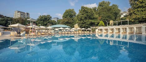 Seasonal outdoor pool, open 7:00 AM to 10:00 PM, pool umbrellas