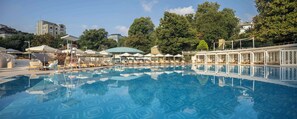 Seasonal outdoor pool, open 7:00 AM to 10:00 PM, pool umbrellas