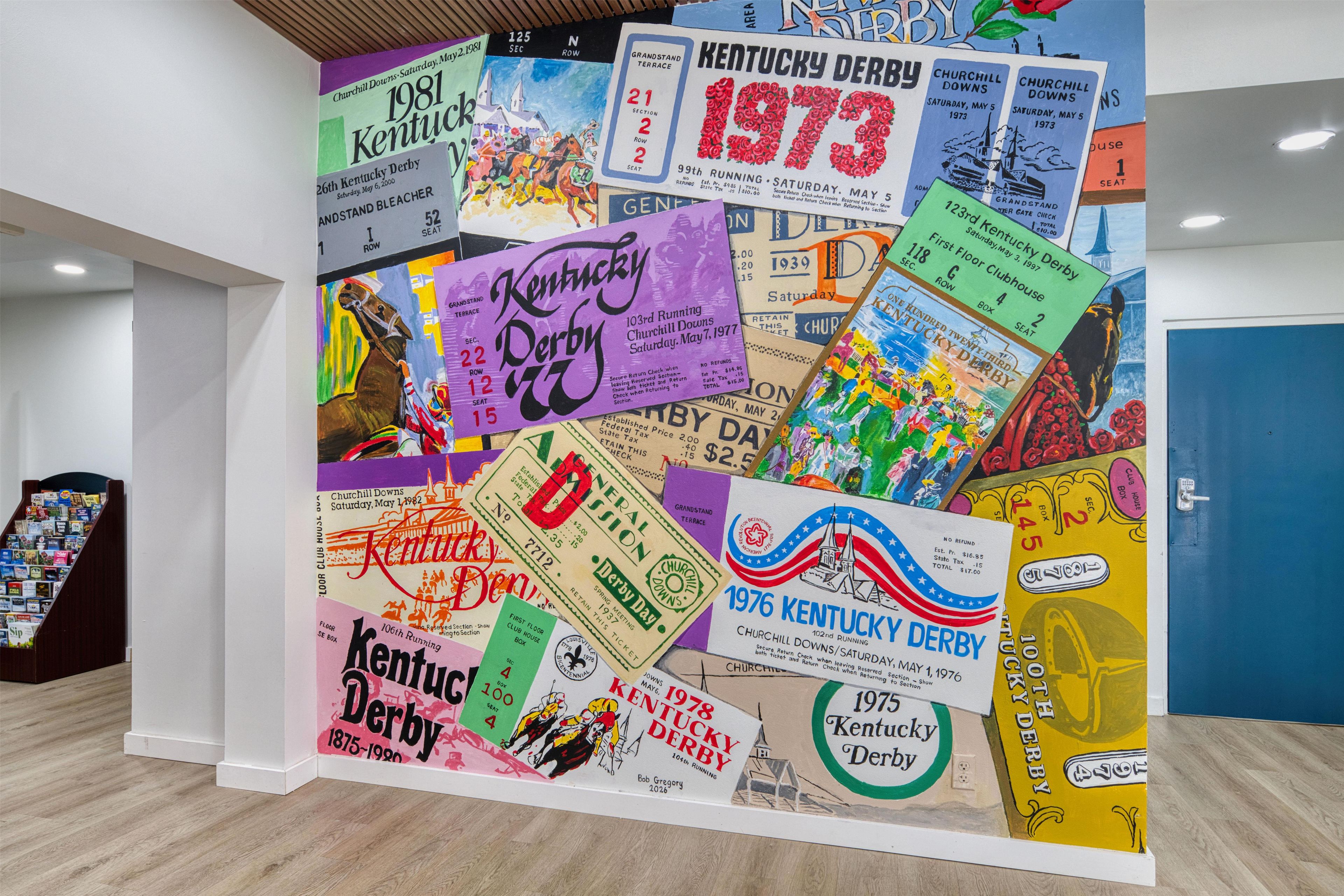 A wall covered with various Kentucky Derby tickets.