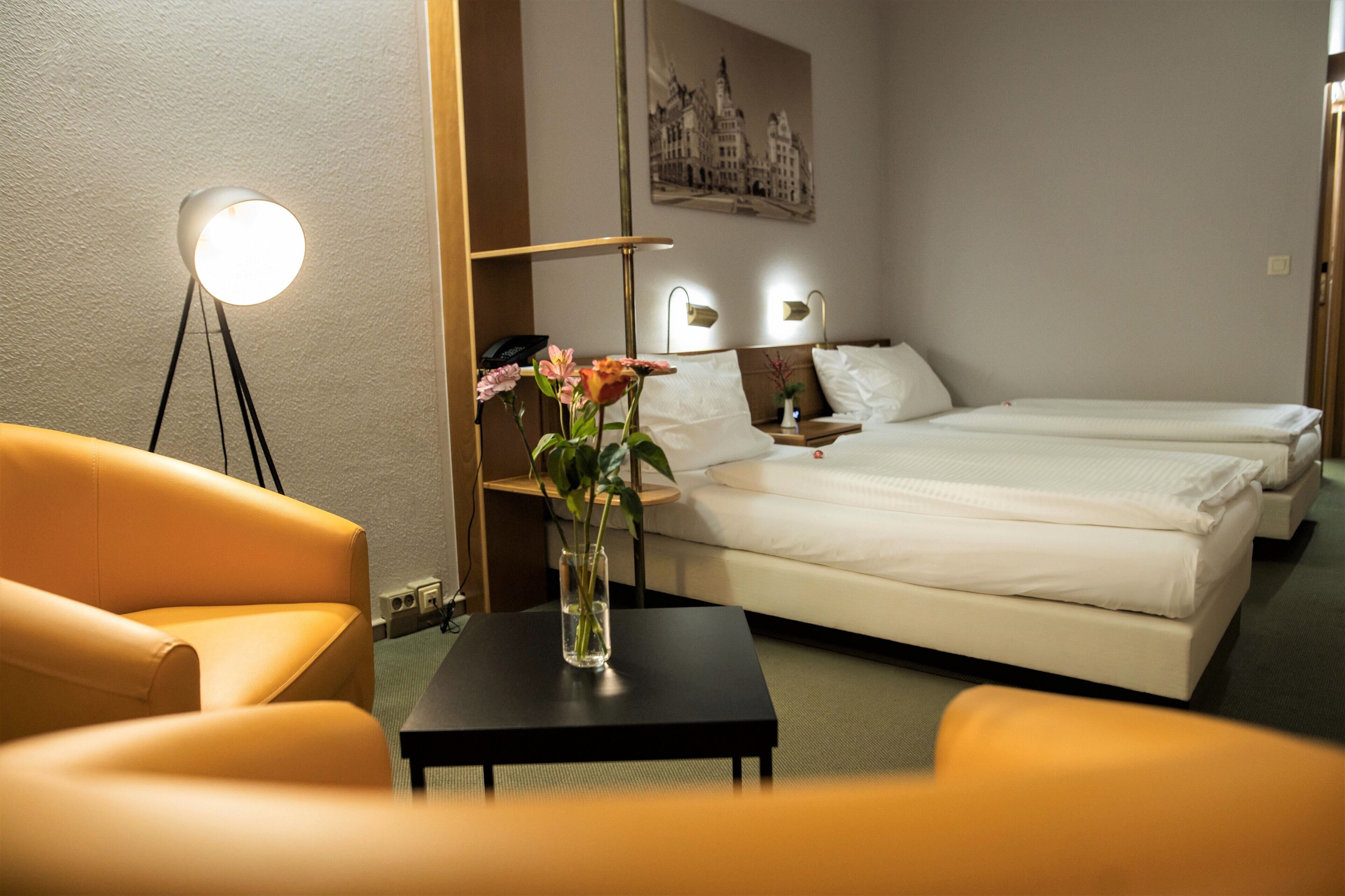 Hypo-allergenic bedding, desk, laptop workspace, blackout curtains