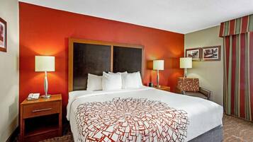 Premium bedding, desk, laptop workspace, blackout drapes