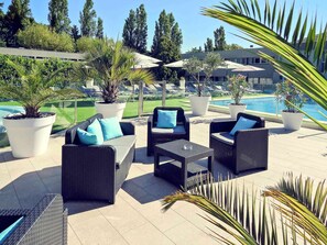 Breakfast, lunch, dinner served; Fusion cuisine, pool views