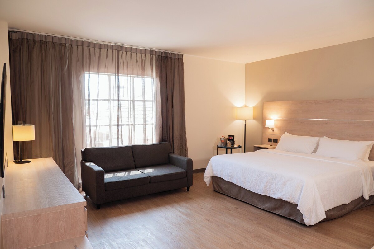 Suite, 1 King Bed | In-room safe, desk, iron/ironing board, cribs (free)
