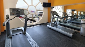A gym with treadmills, a stationary bike, and a large window. - Holiday Inn Express Tecnológico Monterrey by IHG (Monterrey)