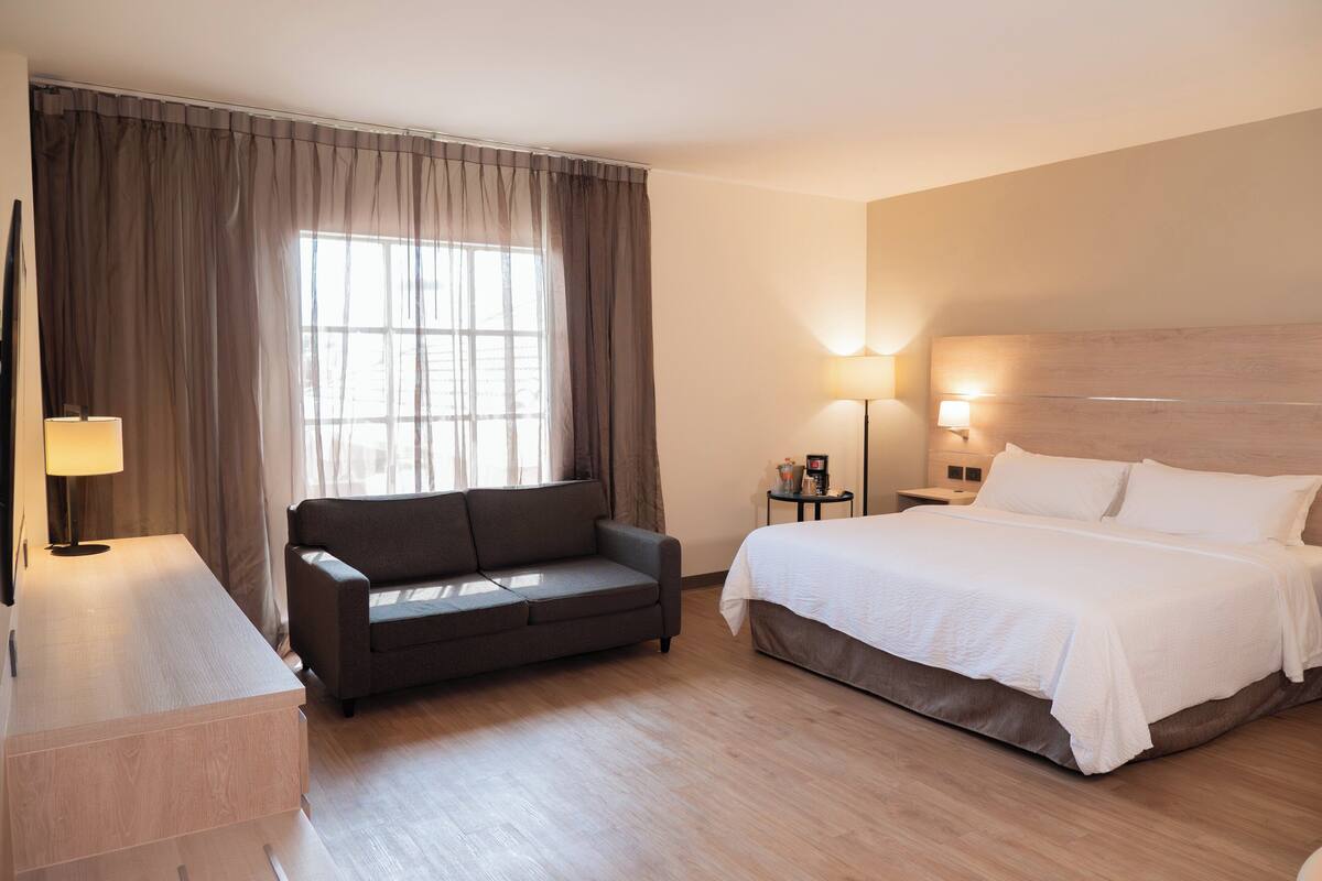 Suite, 1 King Bed | In-room safe, desk, iron/ironing board, cribs (free)