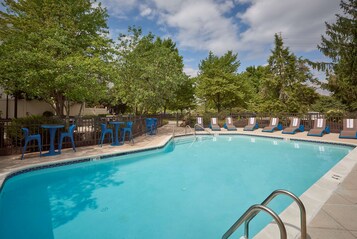 Seasonal outdoor pool, open 8:00 AM to 9:00 PM, pool loungers