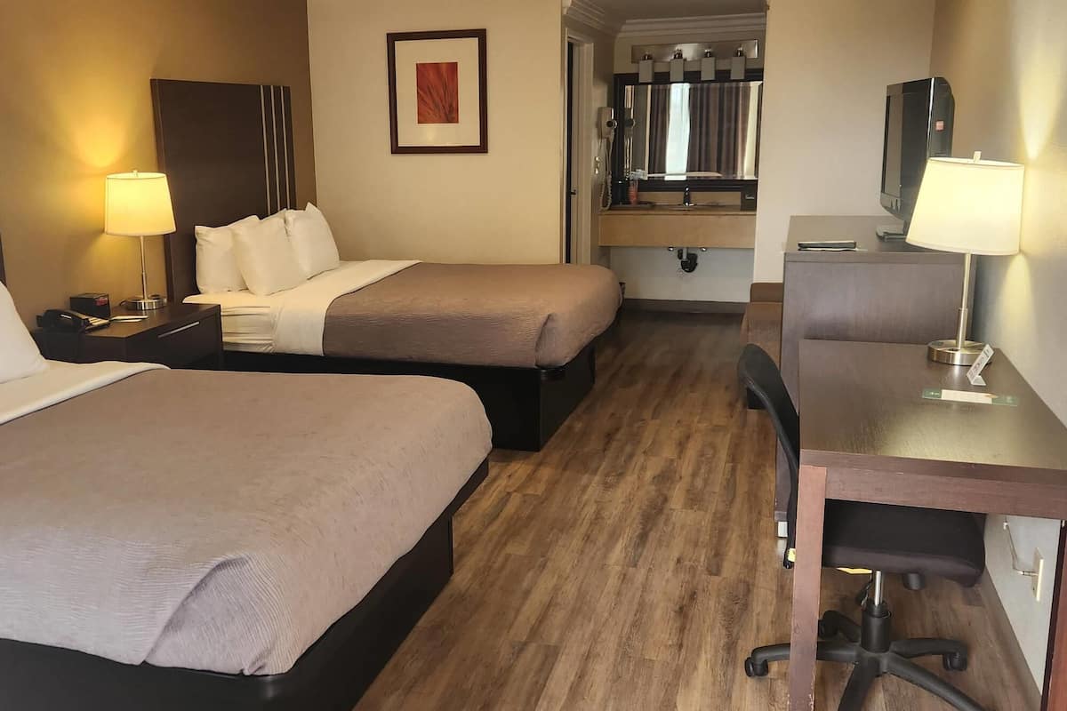 Standard Room, 2 Queen Beds, Non Smoking | 1 bedroom, desk, laptop workspace, blackout drapes