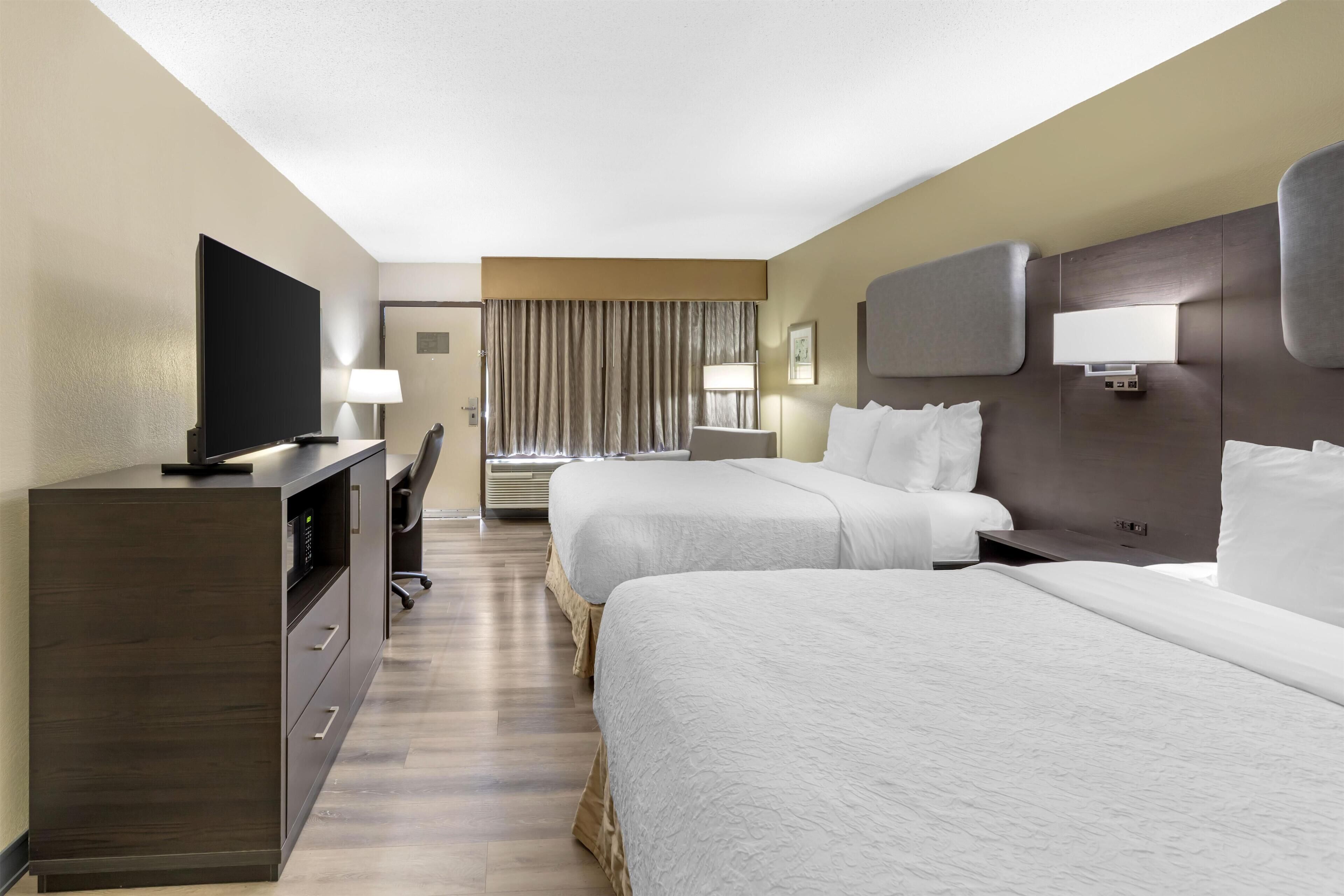 Standard Room, 2 Queen Beds, Non Smoking, Refrigerator & Microwave | Desk, blackout drapes, iron/ironing board, free cribs/infant beds