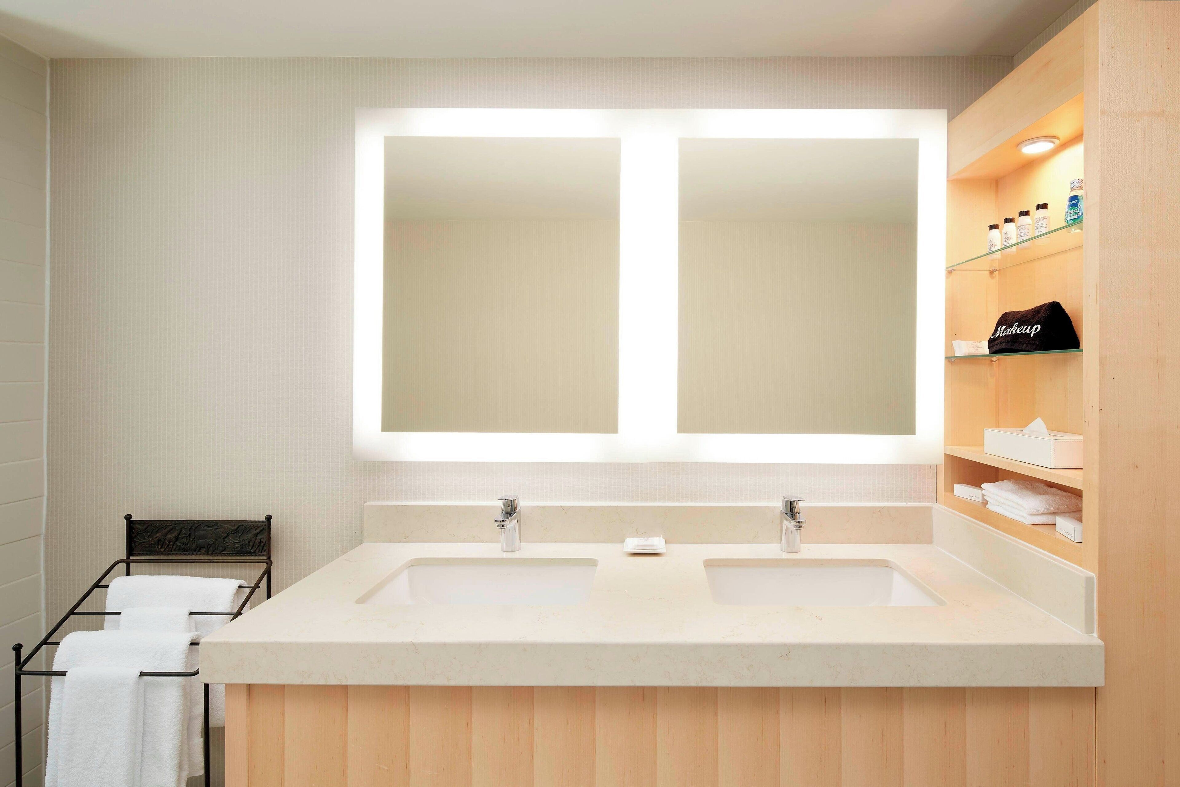 combined shower/bathtub, designer toiletries, hair dryer, towels