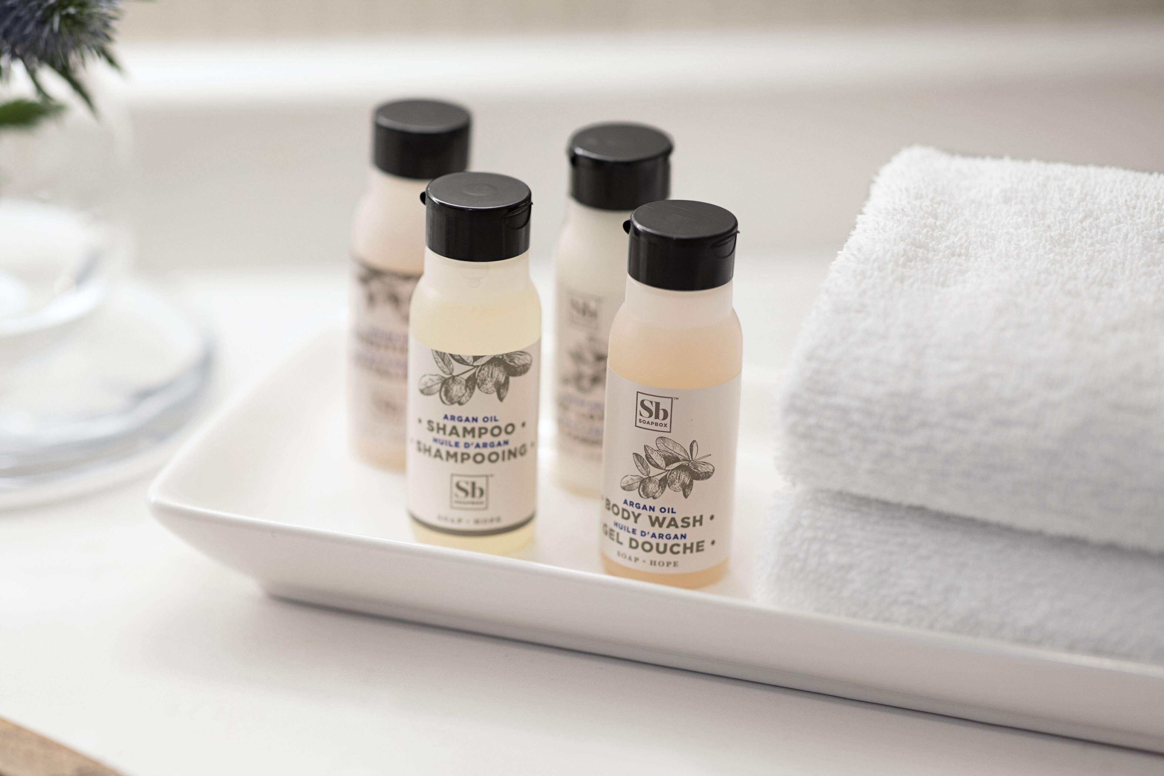 combined shower/bathtub, designer toiletries, hair dryer, towels