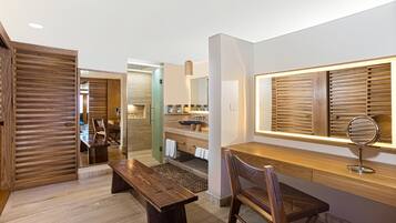 A modern bathroom with a wooden vanity, a sink, and a mirror.