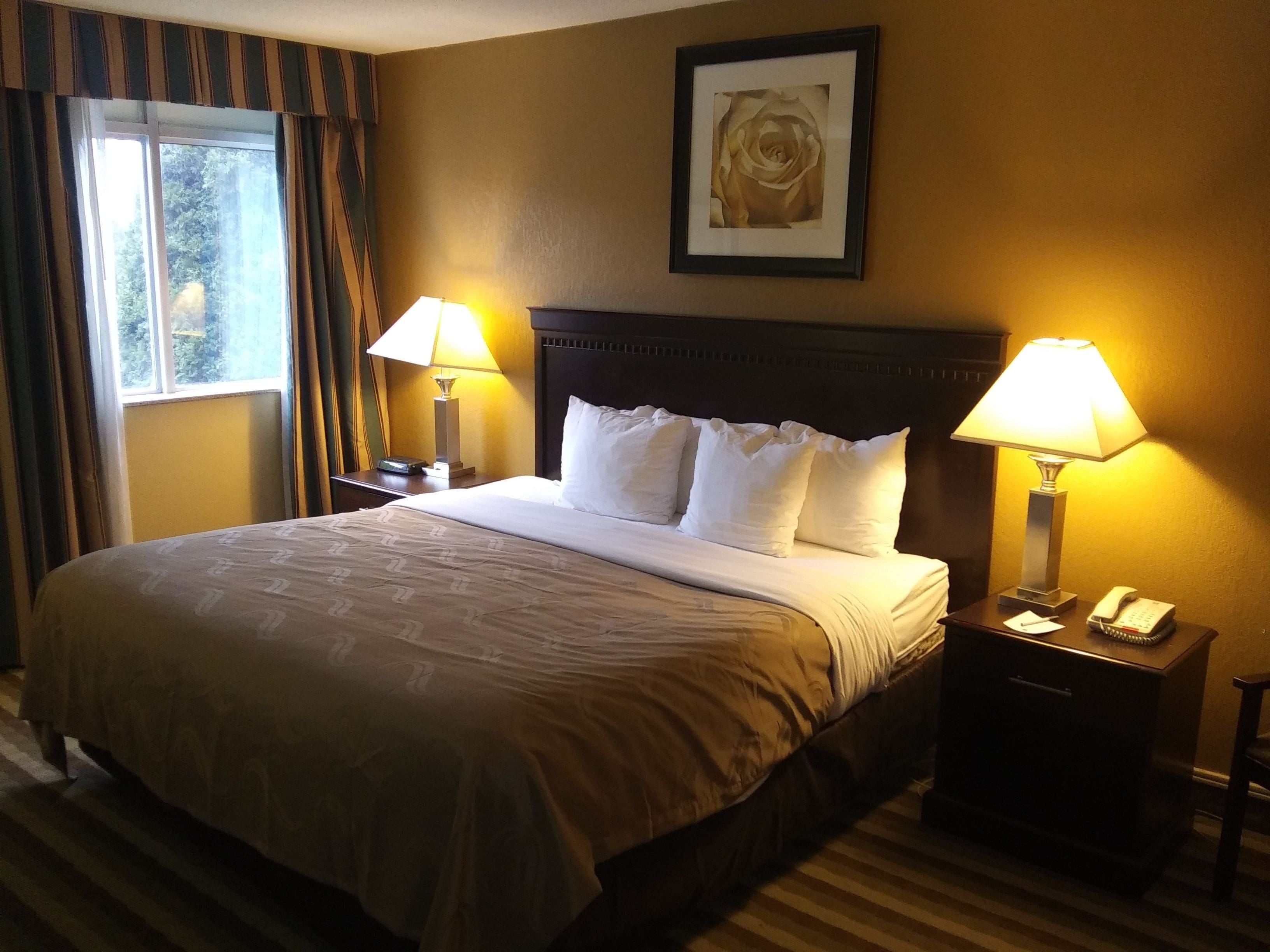 Premium bedding, desk, laptop workspace, iron/ironing board