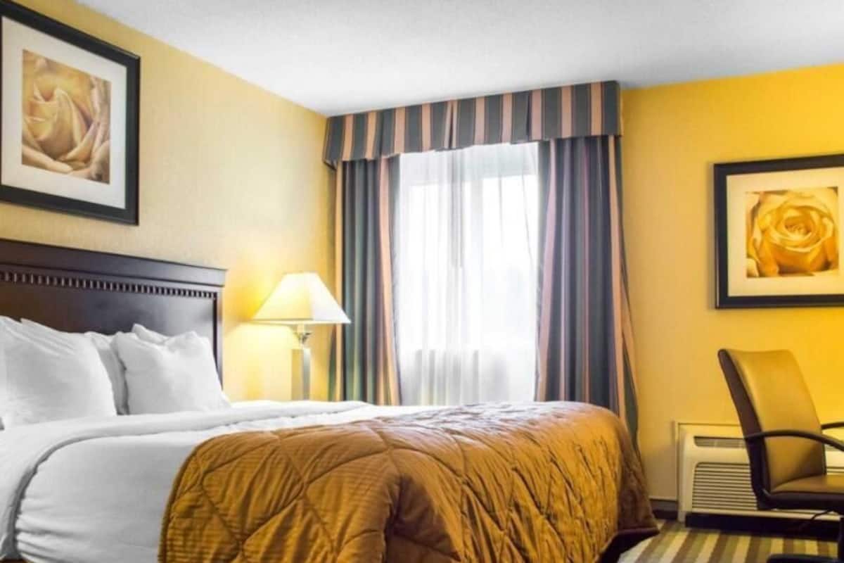 Premium bedding, desk, laptop workspace, iron/ironing board