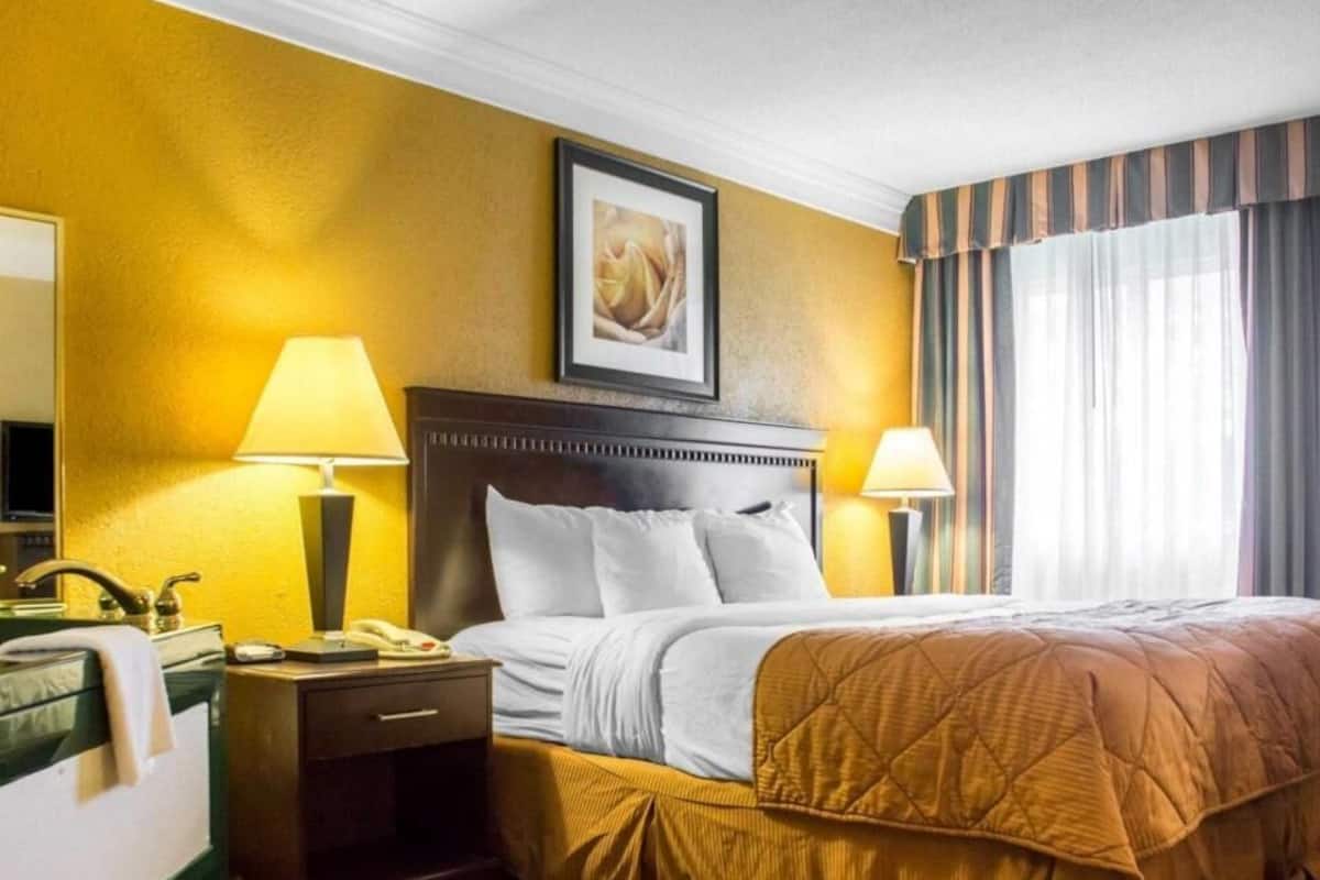 Premium bedding, desk, laptop workspace, iron/ironing board