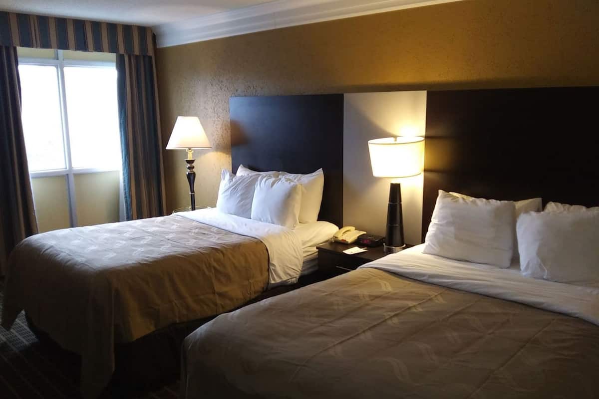 Premium bedding, desk, laptop workspace, iron/ironing board