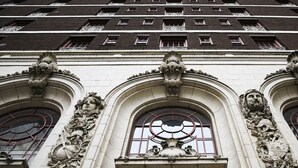 A building facade with ornate architectural details, including sculpted decorations and arched windows. - The Adolphus, Autograph Collection (Dallas)