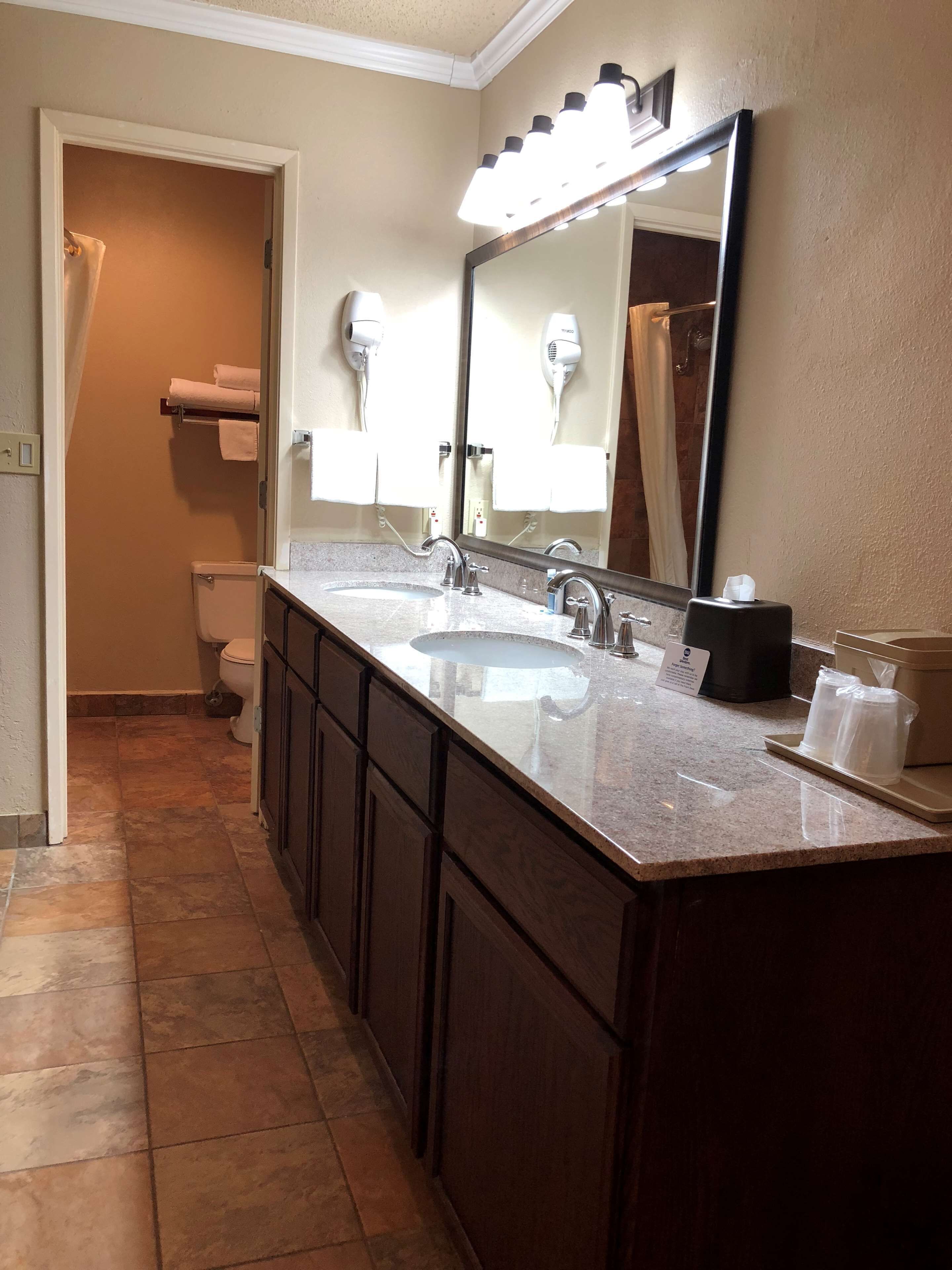 deluxe room, 2 queen beds, non smoking, refrigerator & microwave | bathroom | combined shower/bathtub, free toiletries, hair dryer, towels