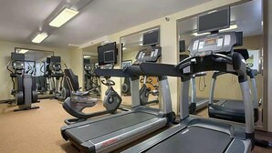 A gym with treadmills, ellipticals, and weight machines.