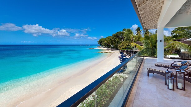A beachfront balcony with a view of a sandy beach and turquoise waters. - The Sandpiper (Holetown)