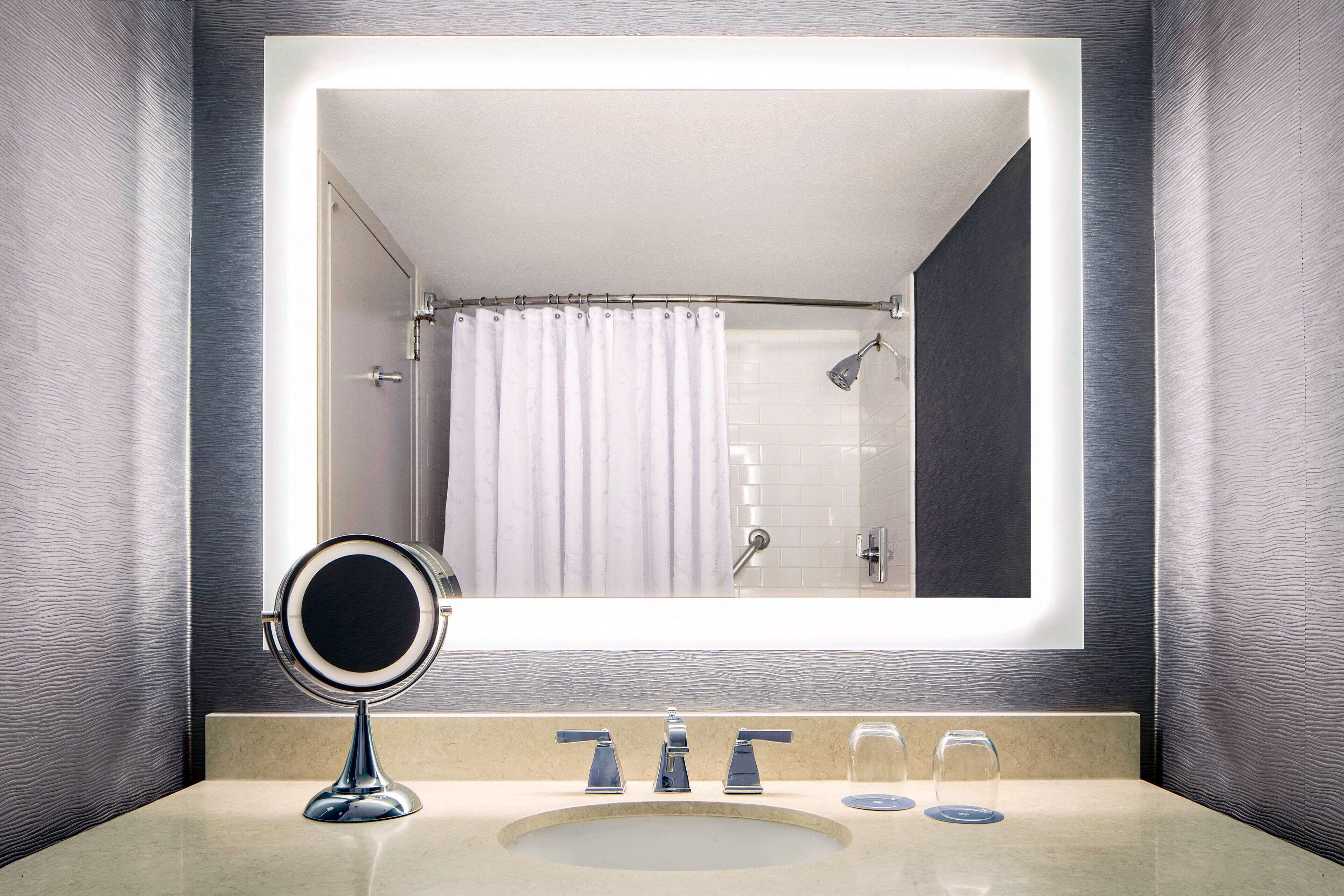 combined shower/bathtub, designer toiletries, hair dryer, towels