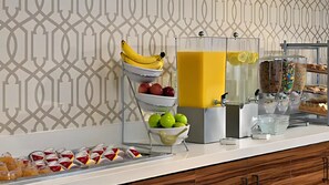 Enjoy a variety of fresh fruits, pastries, and beverages at our buffet.