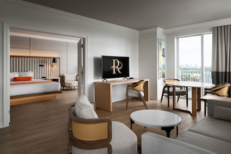 1 Bedroom Suite with Corner Balcony, City View, 1 King Bed | In-room safe, desk, iron/ironing board, free WiFi. Riverside Hotel