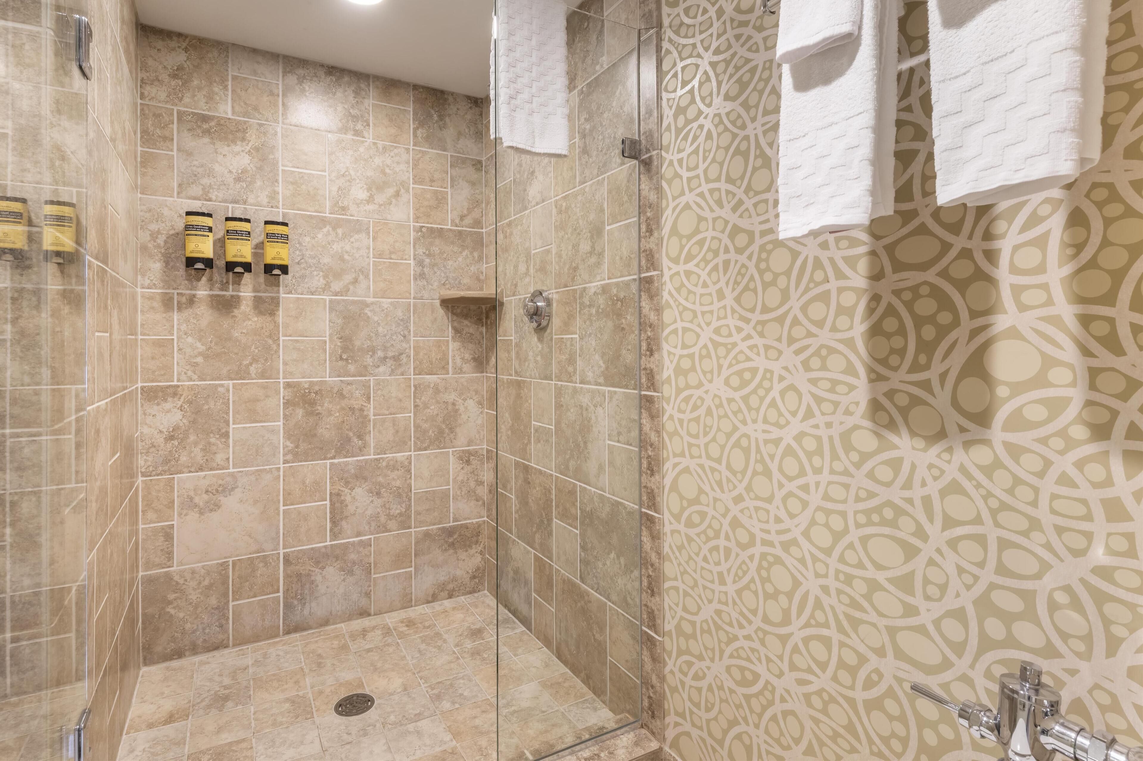 suite, 1 queen bed, non smoking, refrigerator & microwave | bathroom | eco-friendly toiletries, hair dryer, towels, soap