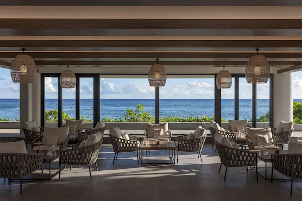 2 bars/lounges, 2 poolside bars, swim-up bar