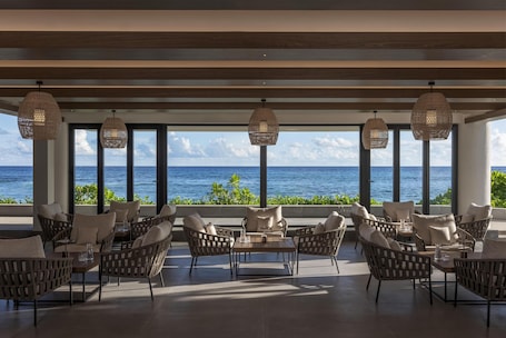 2 bars/lounges, 2 poolside bars, swim-up bar