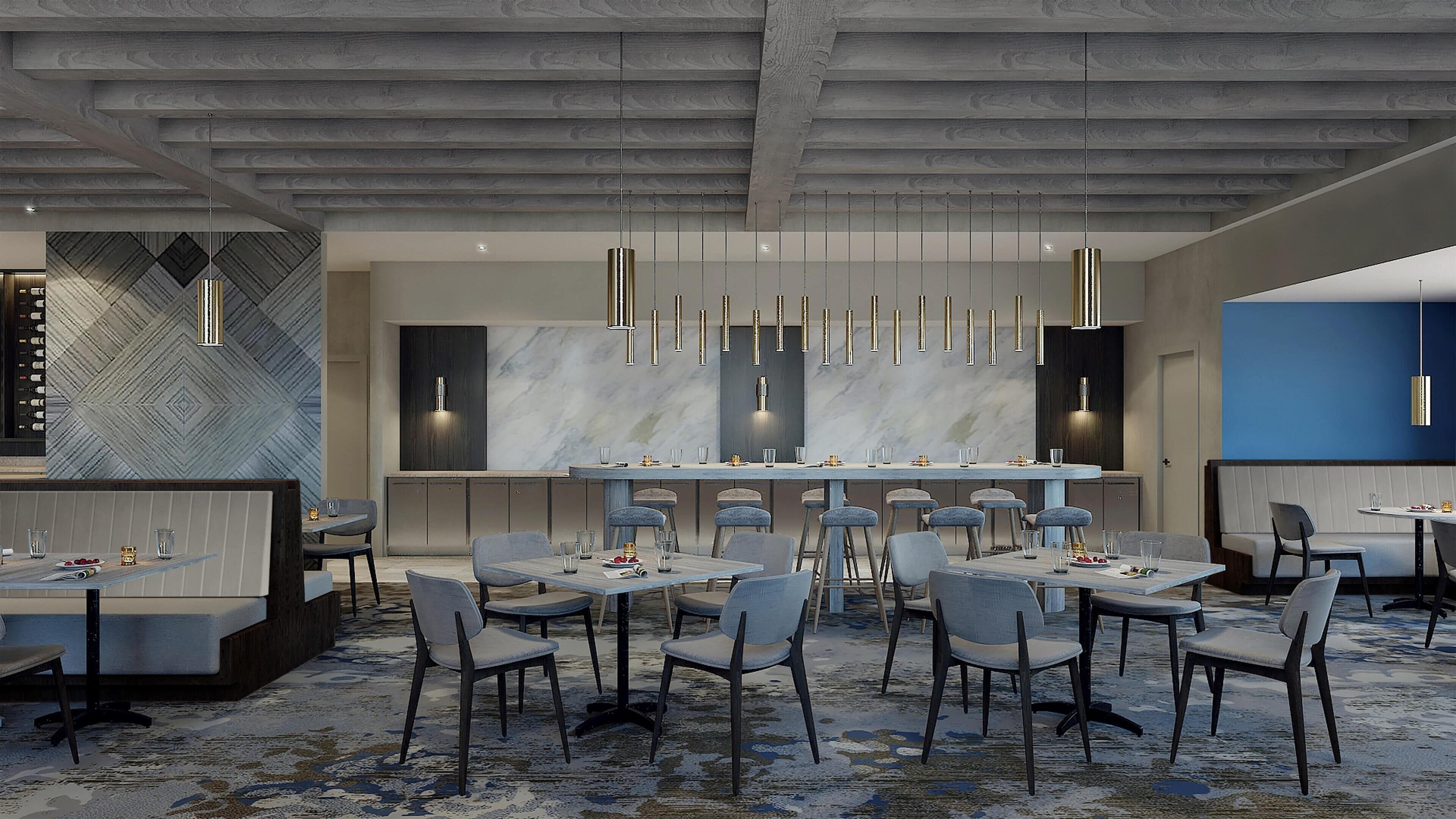 A modern restaurant interior with a bar area, high ceiling, and contemporary lighting fixtures.