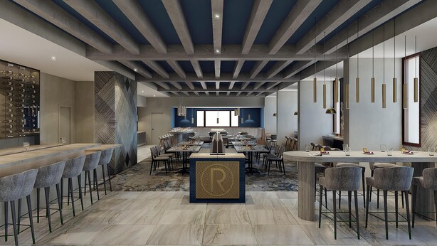 A modern dining area with a central bar, multiple seating arrangements, and a high ceiling with exposed beams. - DoubleTree by Hilton Raleigh Midtown, NC (Raleigh)