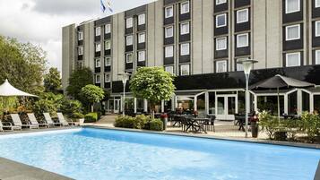 Seasonal outdoor pool, open 9 AM to 9 PM, pool umbrellas, pool loungers