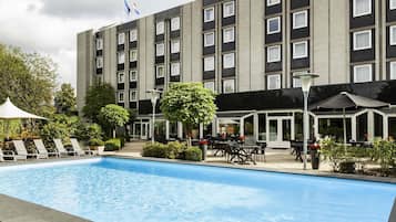 Seasonal outdoor pool, open 9 AM to 9 PM, pool umbrellas, pool loungers