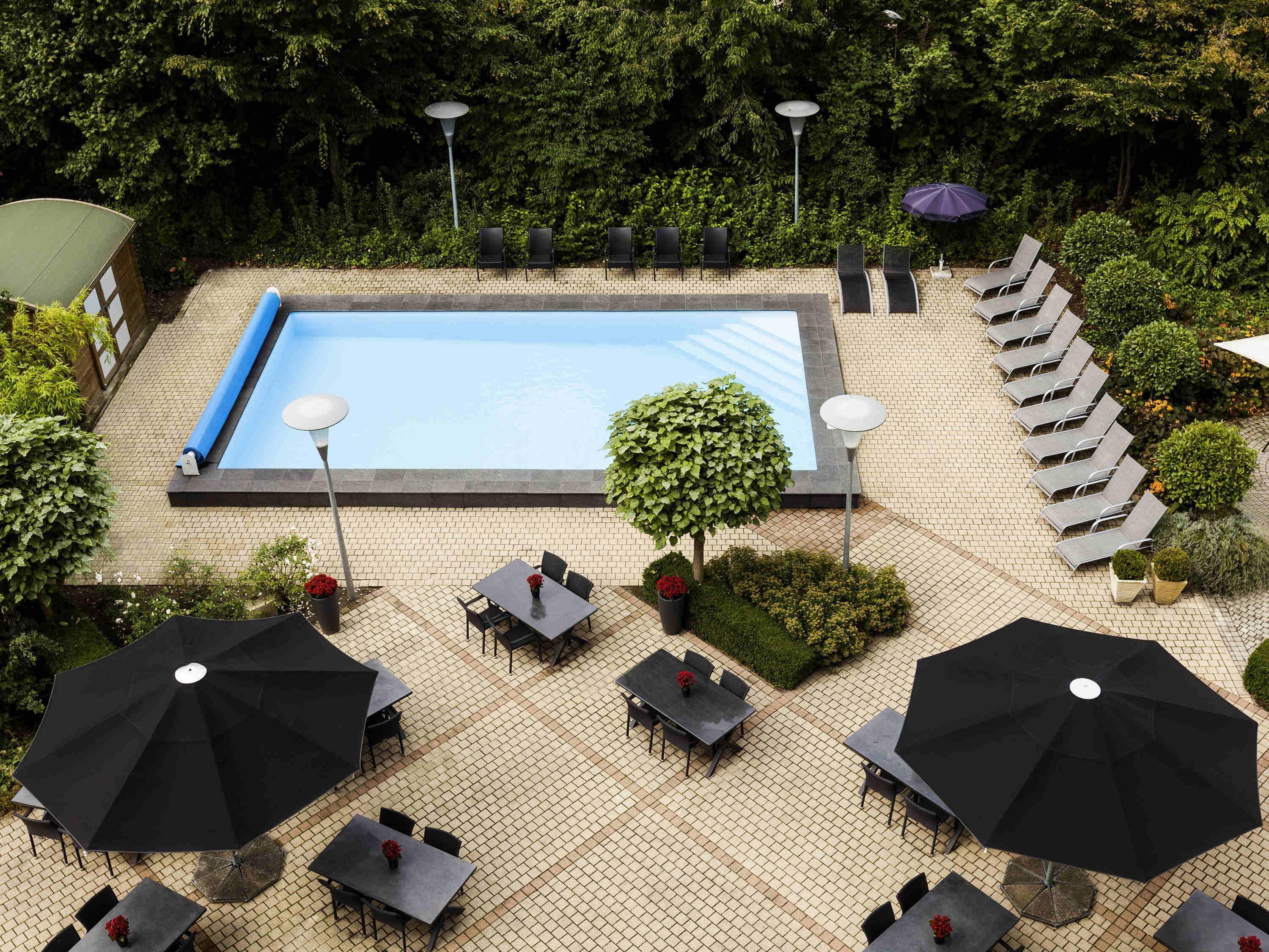 seasonal outdoor pool, open 9 am to 9 pm, pool umbrellas, pool loungers