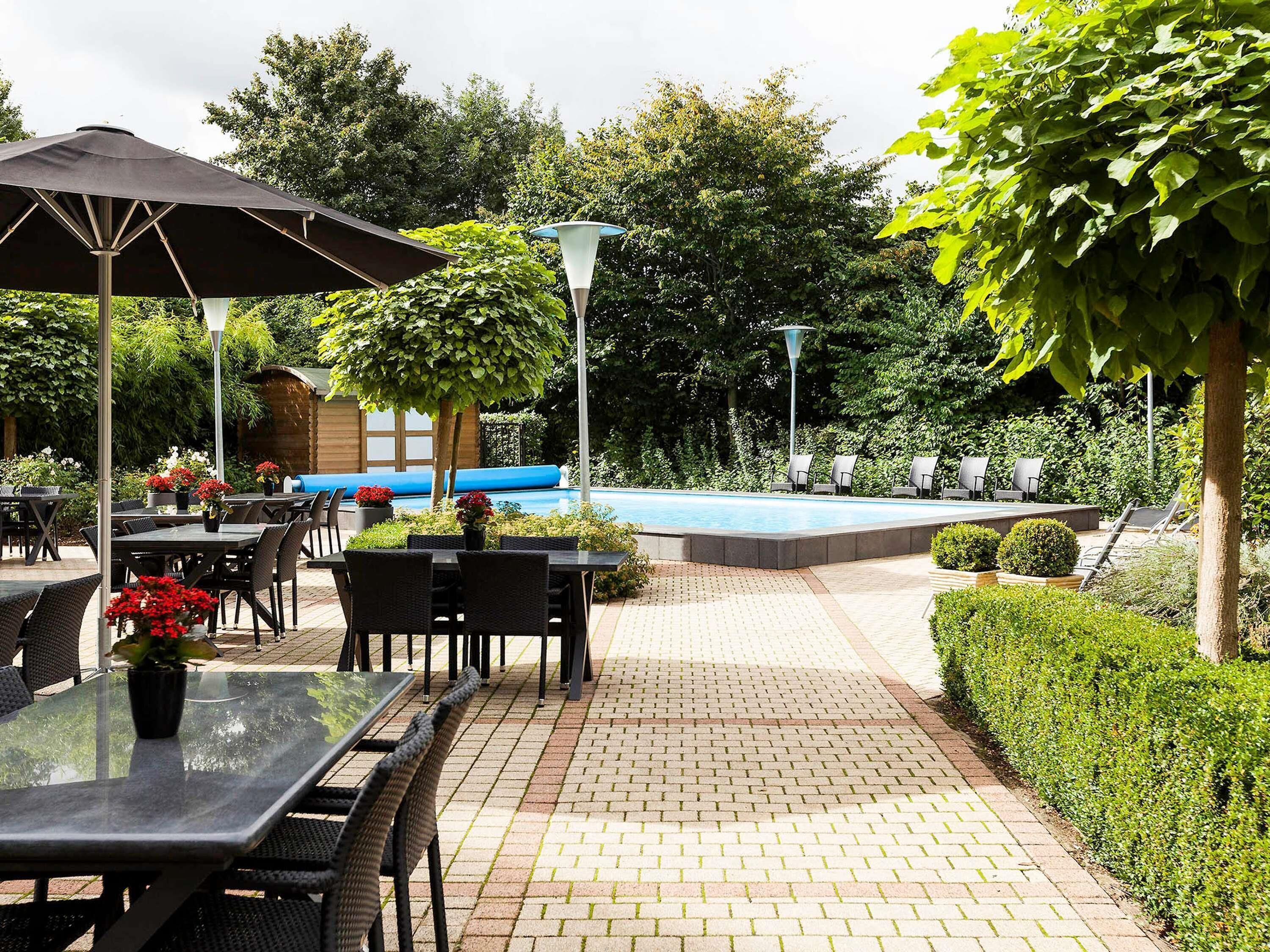 Seasonal outdoor pool, open 9 AM to 9 PM, pool umbrellas, pool loungers