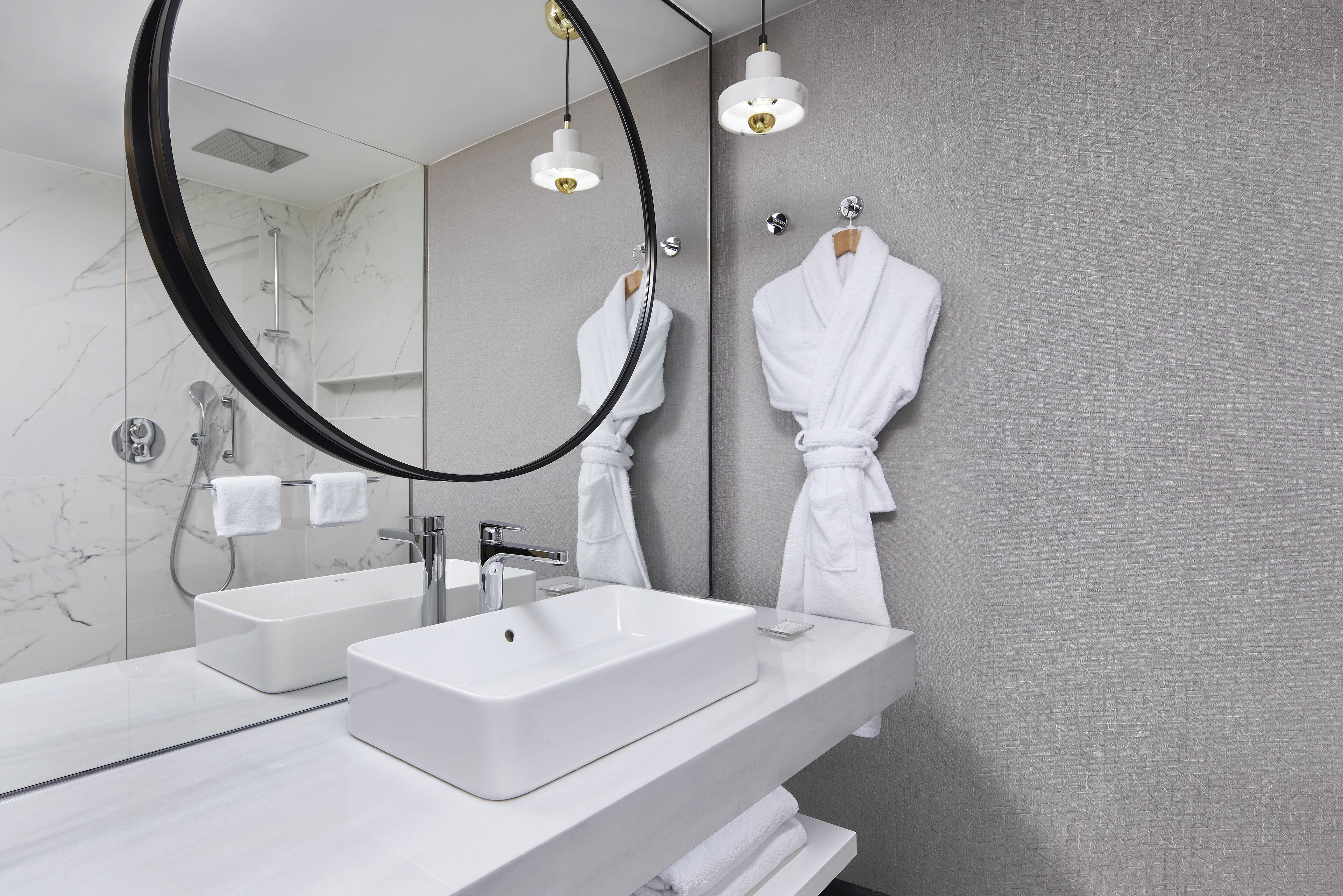 designer toiletries, hair dryer, bathrobes, slippers